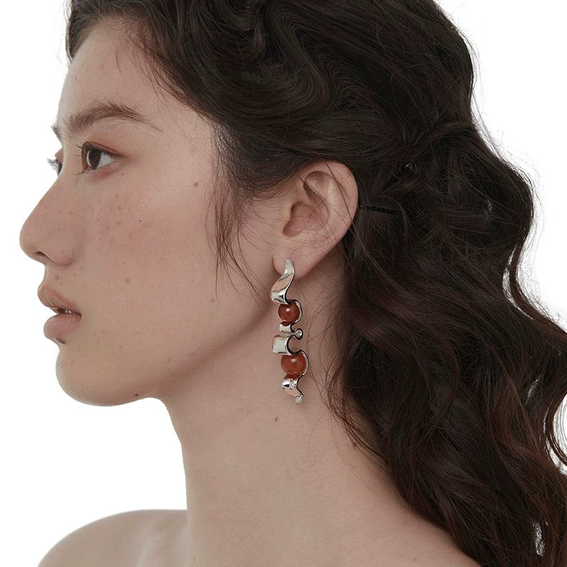 Silver earring with dual red stones